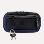 Travelpro Altitude Sling 2L in Aviator Navy, front view with key leash attached and zippered pocket visible.
