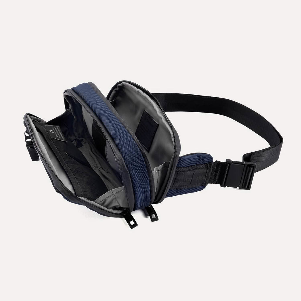 Travelpro Altitude Sling 2L in Aviator Navy, interior view with mesh organizer and multiple compartments fully unzipped.

