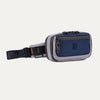 Angled front view of the Travelpro Altitude Sling 2L in Stellar Navy/Grey, featuring a front zip pocket and adjustable buckle strap.

