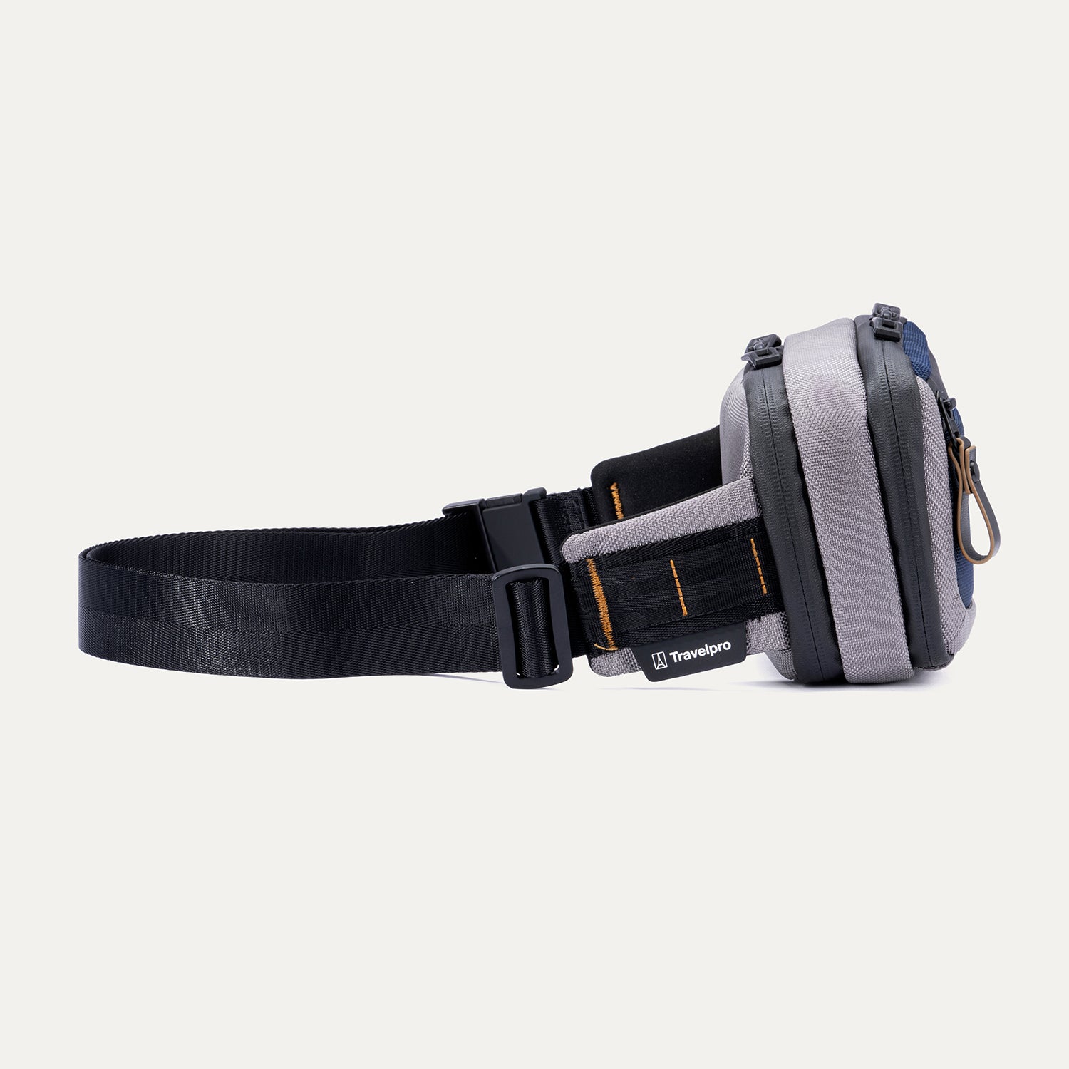 Side view of the Travelpro Altitude Sling 2L in Stellar Navy/Grey, showing the buckle closure and stitched brand tag.
