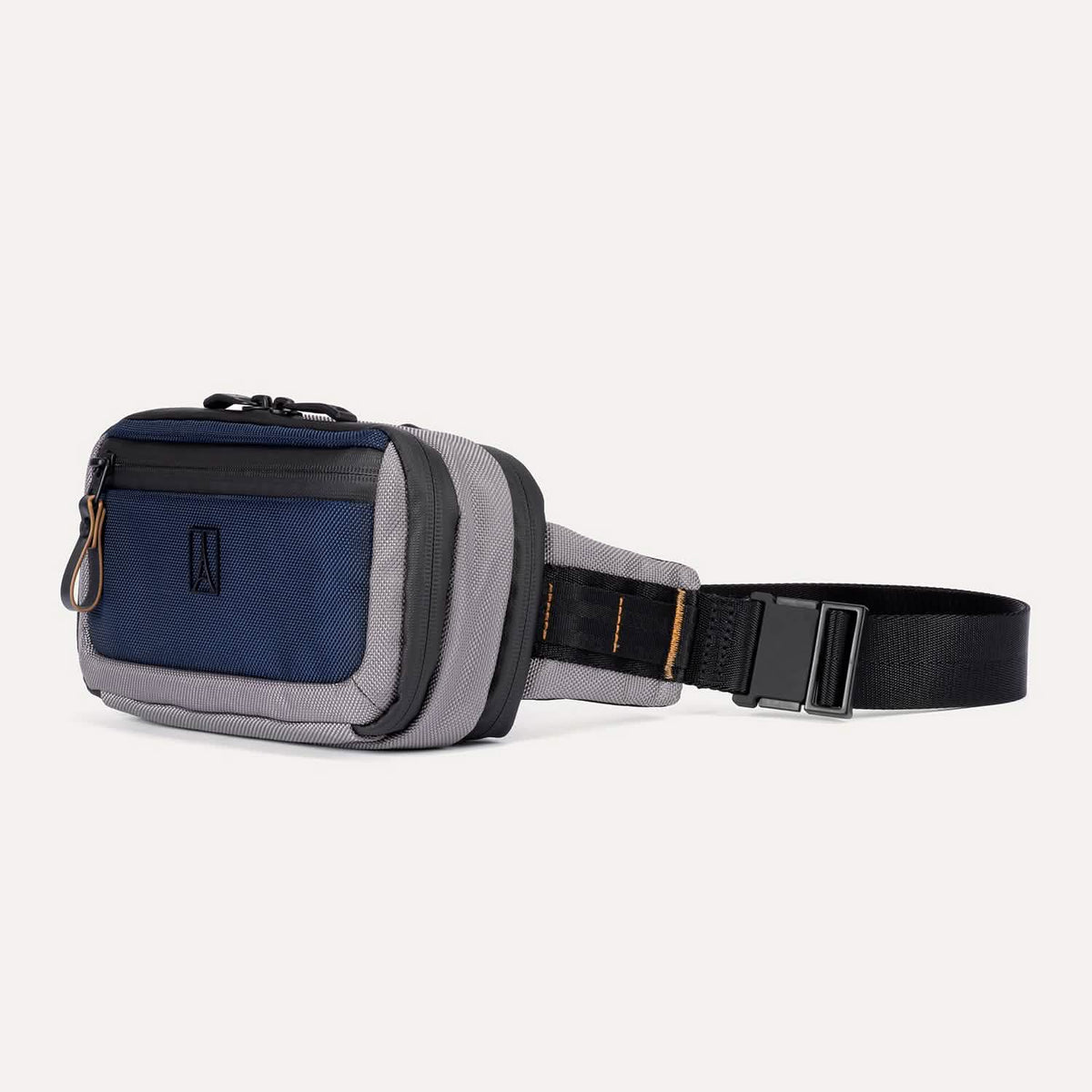 Travelpro Altitude Sling 2L in Stellar Navy/Grey, featuring front zippered pocket and adjustable buckle strap.
