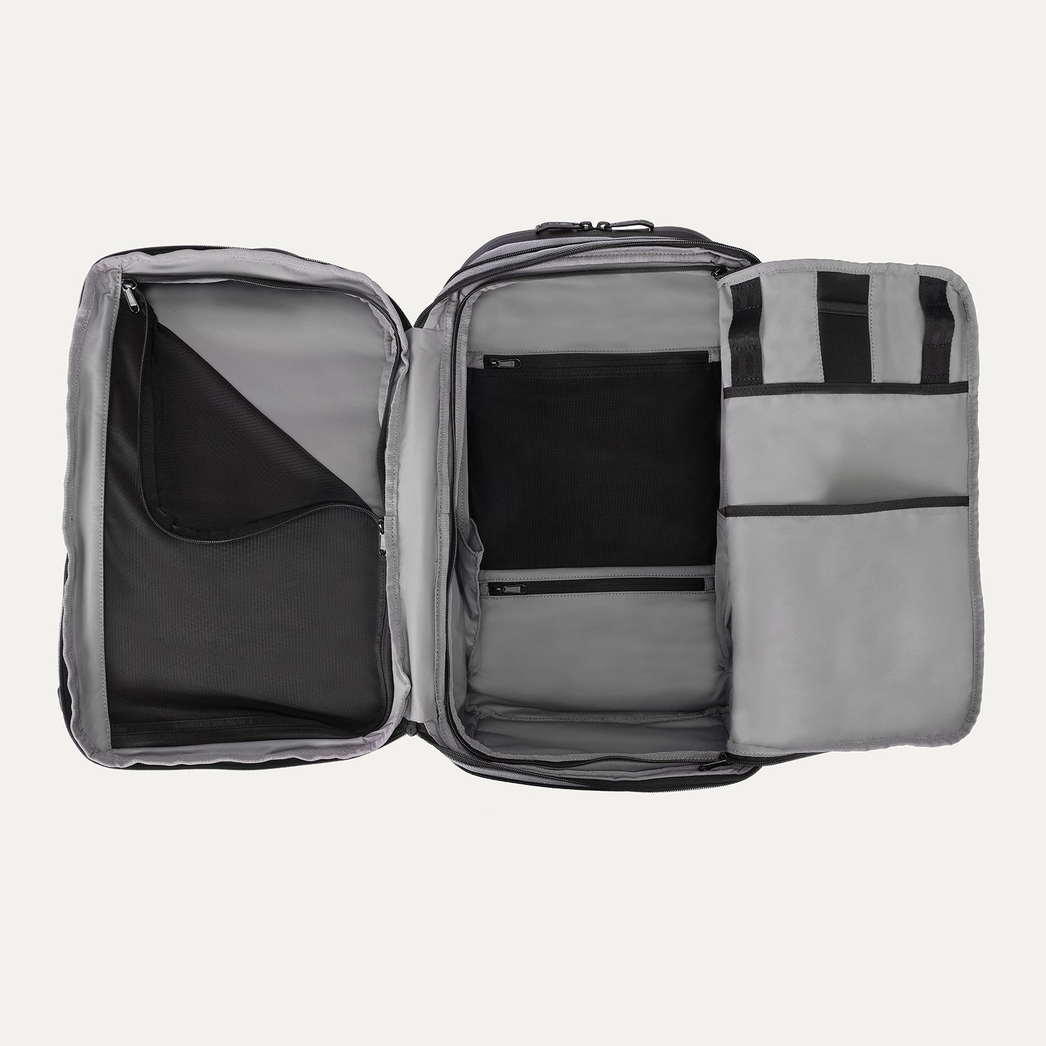 Interior view of Travelpro Altitude All-Purpose Laptop Backpack in Falcon Grey, showing divided compartments and multiple mesh and slip pockets.


