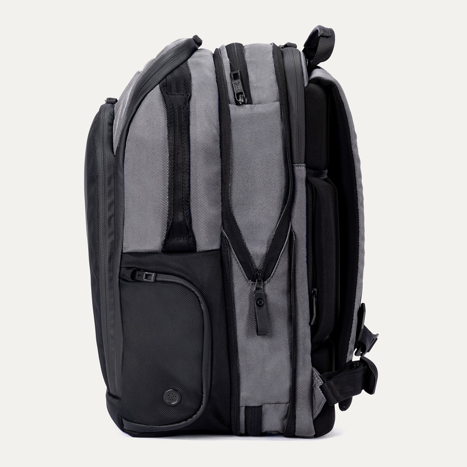 Expanded side view of Travelpro Altitude All-Purpose Laptop Backpack in Falcon Grey, featuring added packing capacity.
