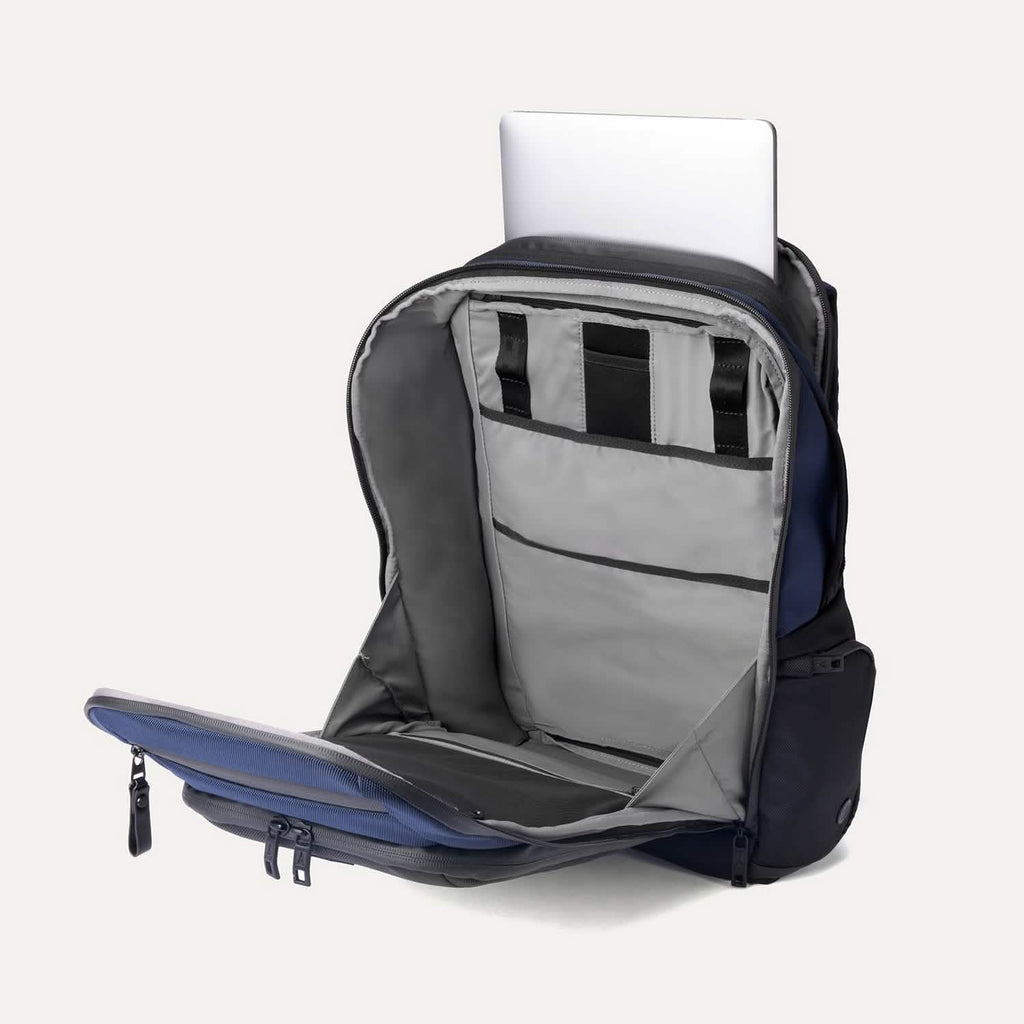 Interior view of the Travelpro Altitude All-Purpose Backpack in Aviator Navy, featuring a laptop in padded storage sleeves.








Ask ChatGPT
