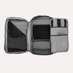 Interior view of the Travelpro Altitude All-Purpose Backpack in Aviator Navy, showing multiple compartments and mesh zippered pockets.
