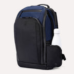 Front angled view of Travelpro Altitude All-Purpose Laptop Backpack in Aviator Navy, featuring top zip pocket and exterior bottle holder.
