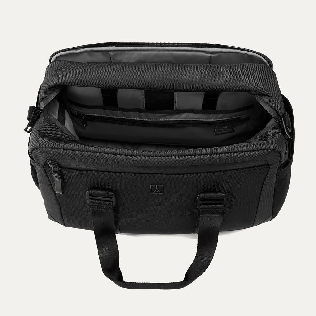 Top-down view of the Travelpro Altitude Day-to-Day Duffel in Jet Black, showing interior compartments and padded laptop sleeve.
