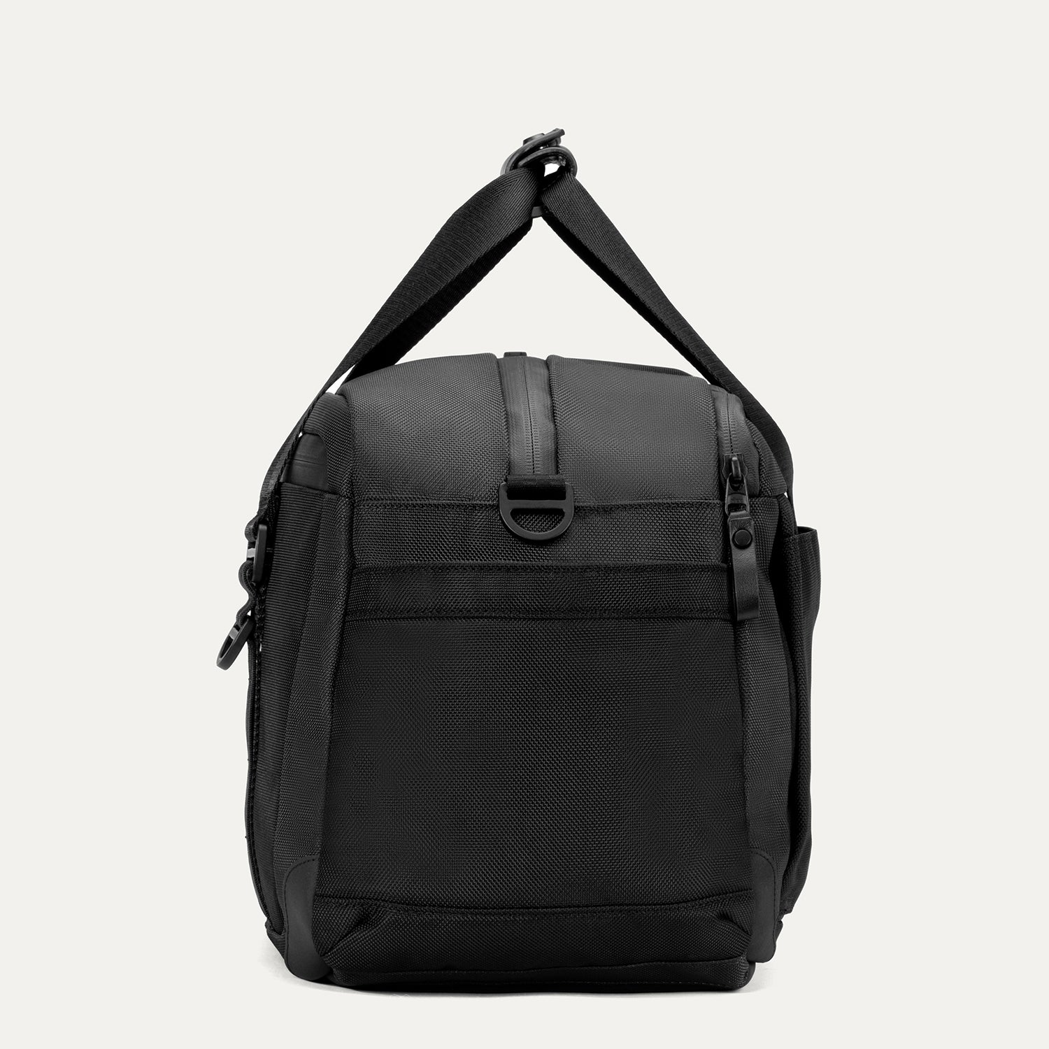 Side view of the Travelpro Altitude Day-to-Day Duffel in Jet Black, featuring an adjustable shoulder strap and side zip pocket.
