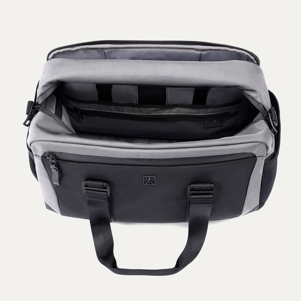 Top view of the Travelpro Altitude Day-to-Day Duffel in Falcon Grey, showing interior organizational compartments and padded laptop sleeve.
