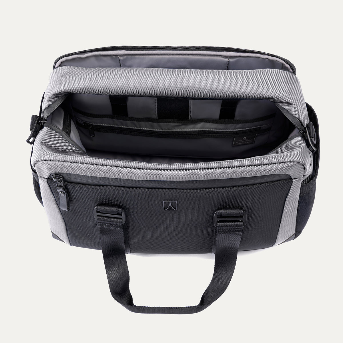 Top view of the Travelpro Altitude Day-to-Day Duffel in Falcon Grey, showing interior organizational compartments and padded laptop sleeve.

