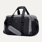 Angled front view of the Travelpro Altitude Day-to-Day Duffel in Falcon Grey, highlighting the zippered pocket and adjustable shoulder strap.

