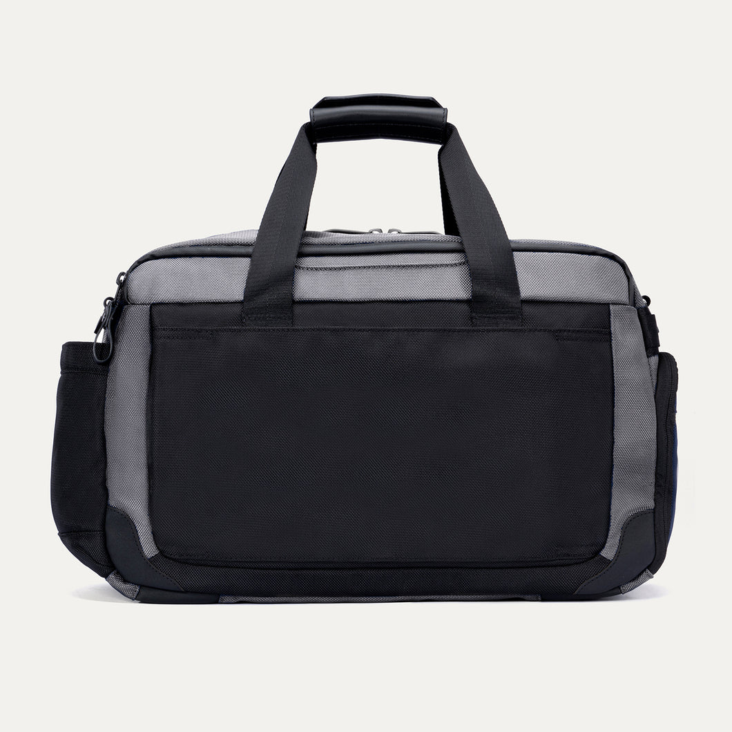 Rear view of the Travelpro Altitude Day-to-Day Duffel in Falcon Grey, featuring a full-width exterior slip pocket.

