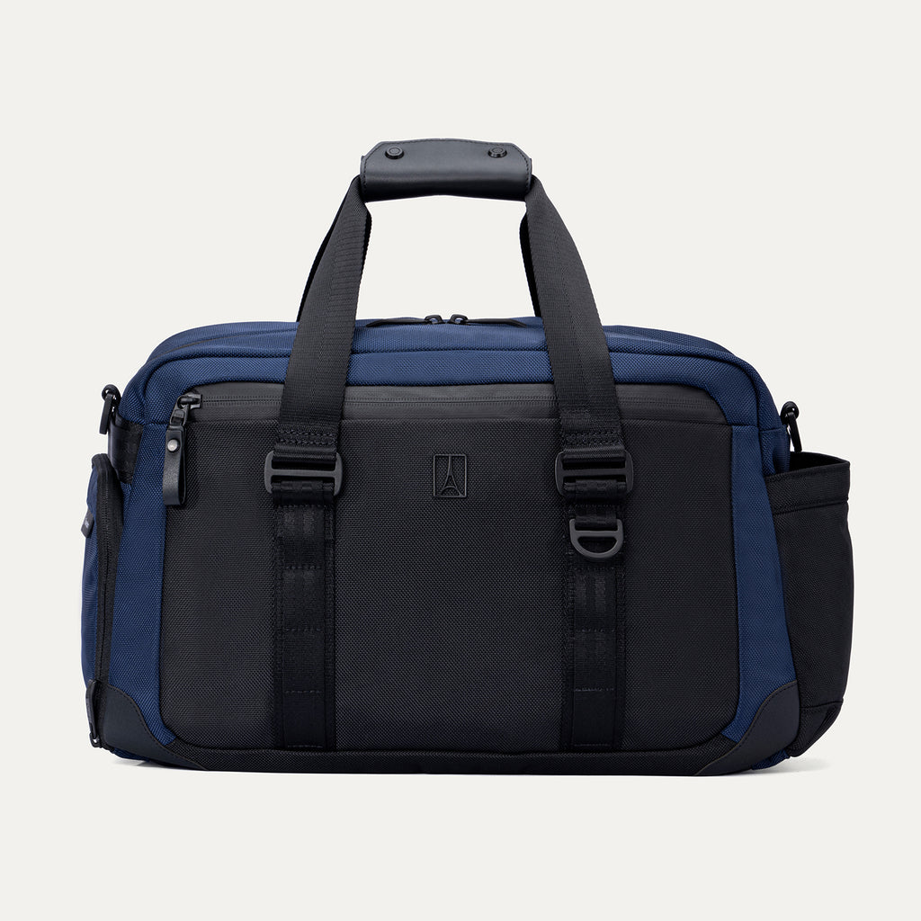 Front view of the Travelpro Altitude Day-to-Day Duffel in Aviator Navy, featuring daisy chain loops and dual zippered compartments.
