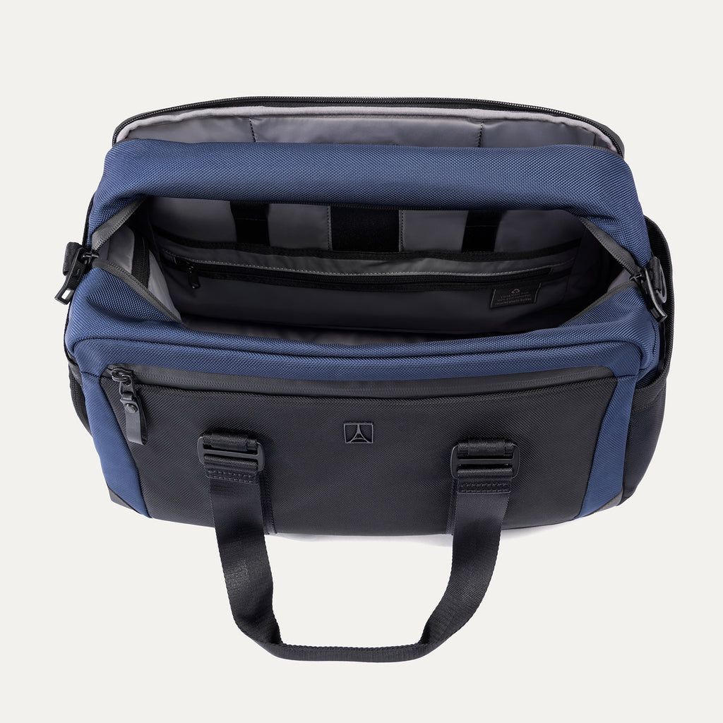 Interior view of Travelpro Altitude Day-to-Day Duffel in Aviator Navy, with padded laptop sleeve and organizational compartments.
