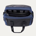 Interior view of Travelpro Altitude Day-to-Day Duffel in Aviator Navy, with padded laptop sleeve and organizational compartments.
