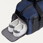 Travelpro Altitude Day-to-Day Duffel in Aviator Navy with dedicated zippered shoe compartment, keeping footwear separate and organized.
