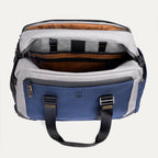 Top-down view of the Travelpro Altitude Day-to-Day Duffel in Stellar Navy/Grey, showing interior compartments with padded laptop sleeve.