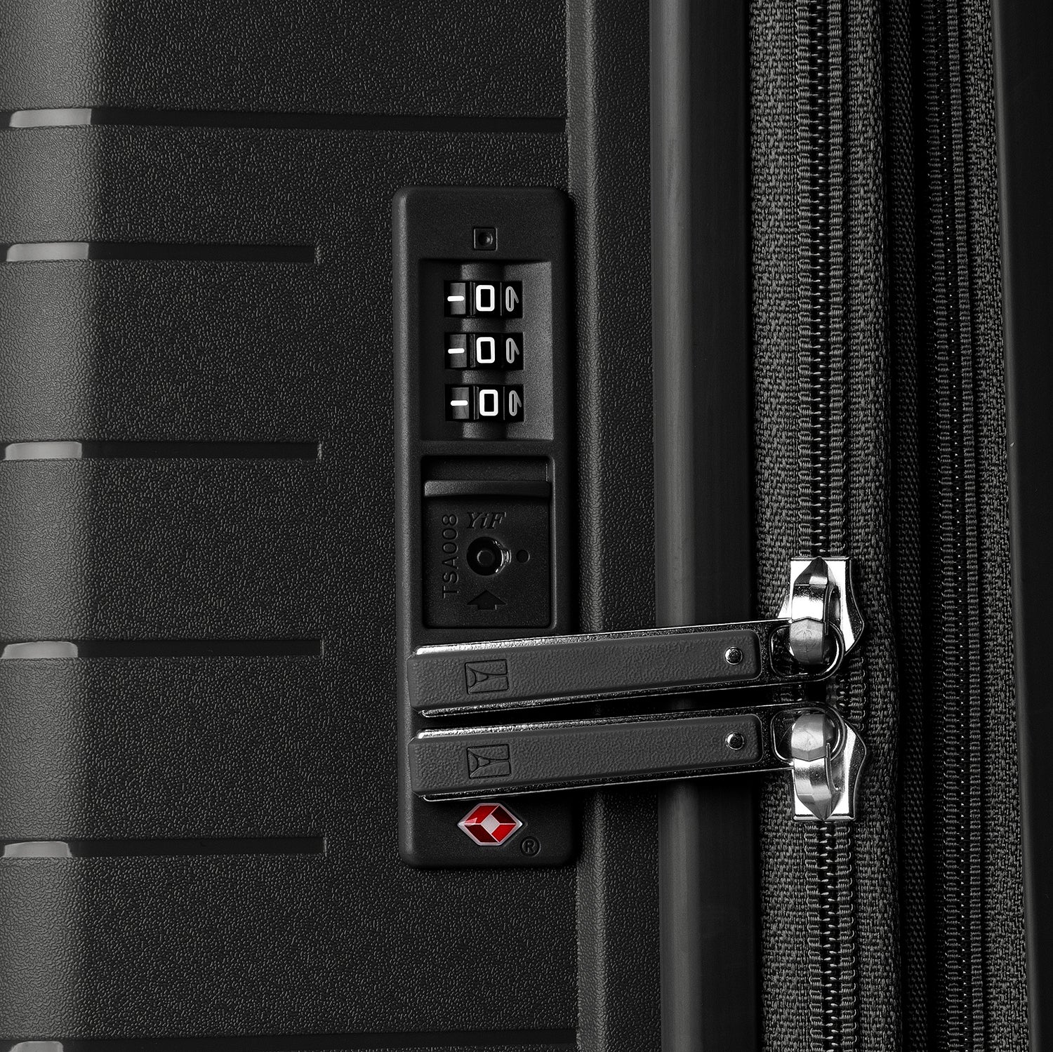 Close-up detail view of the Optima Expandable Compact Carry-on Spinner in Black, showcasing the integrated, TSA-compliant combination lock and secure, durable zipper pulls.