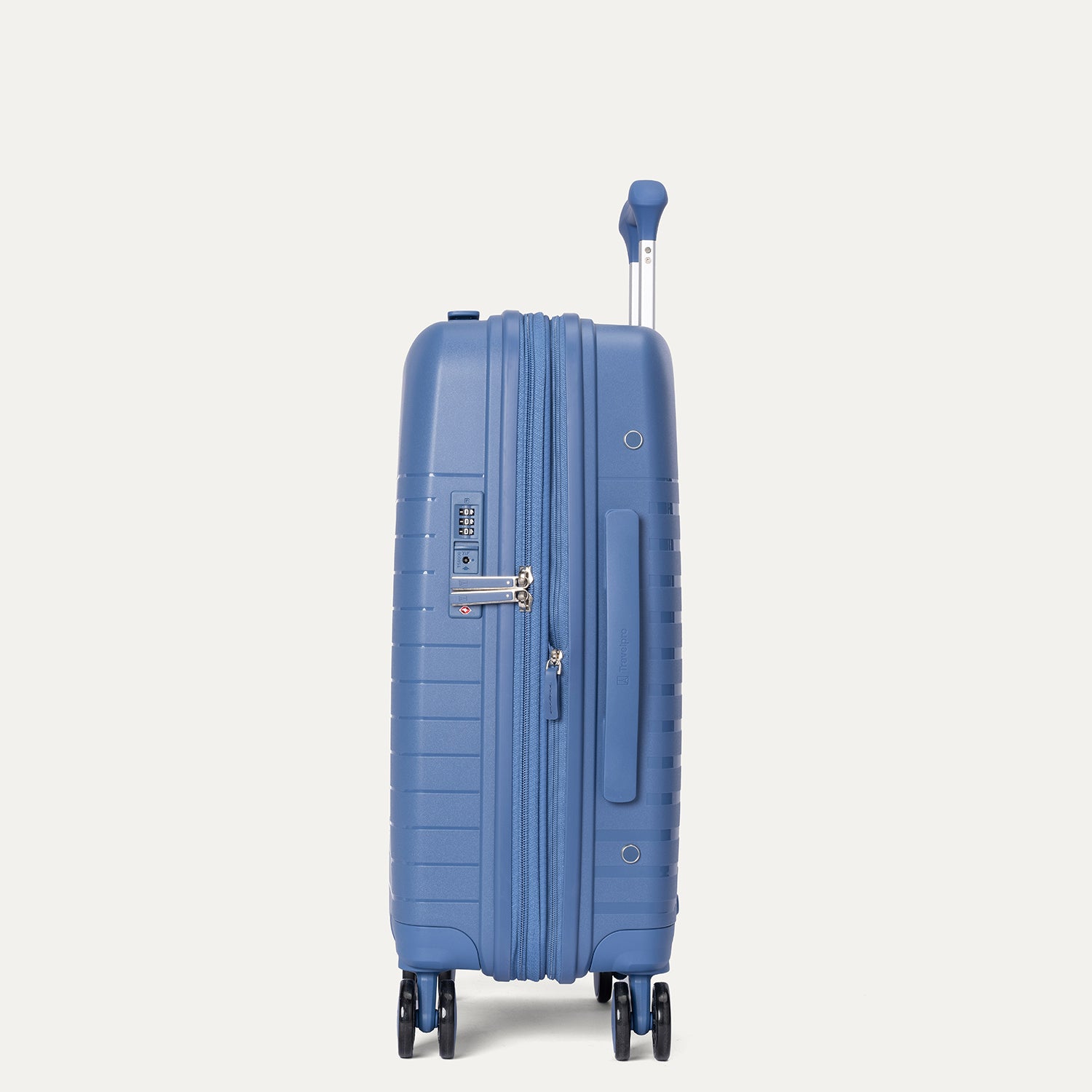 Blue suitcase with wheels on a light gray background