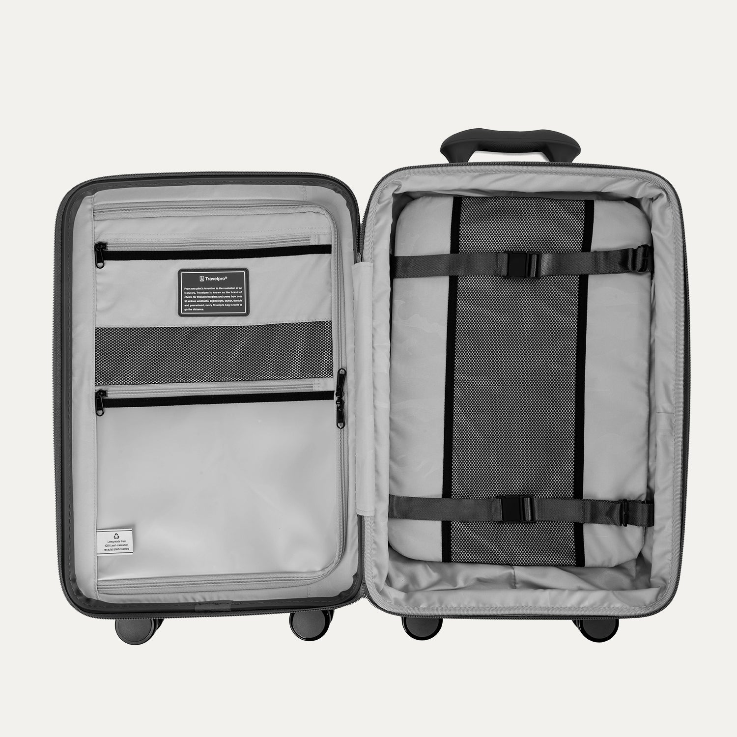 Open gray suitcase with interior organization panels on a light gray background