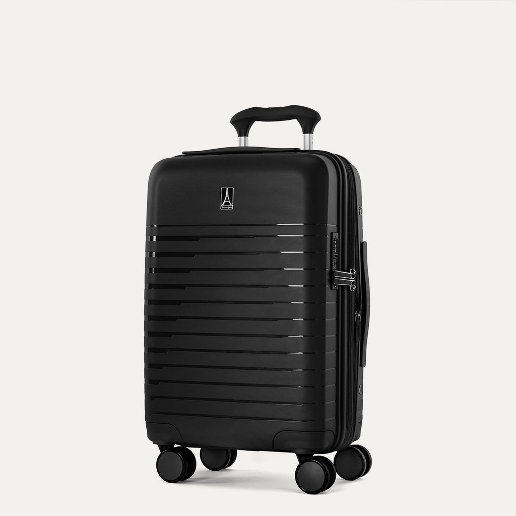Black suitcase with wheels on a light gray background