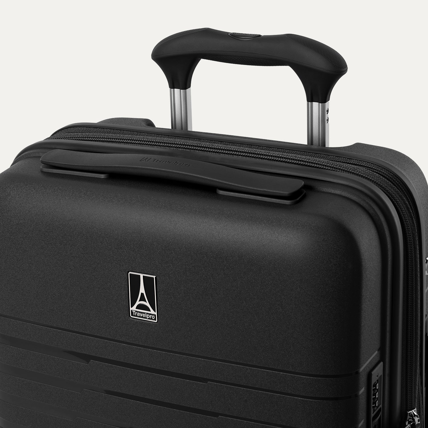 Black suitcase with handle and logo on a light gray background
