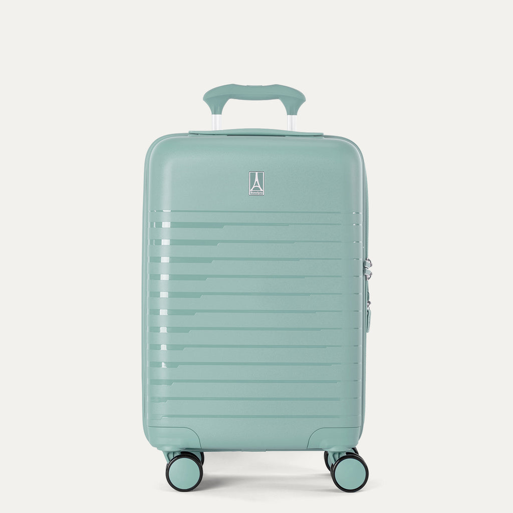 Front-facing view of the Optima Expandable Carry-on Spinner in Lunar Rock, showing the upright hardshell suitcase with horizontal ribbed detailing, an extended telescoping handle, top carry handle, and smooth-rolling multi-directional wheels against a solid off-white background.