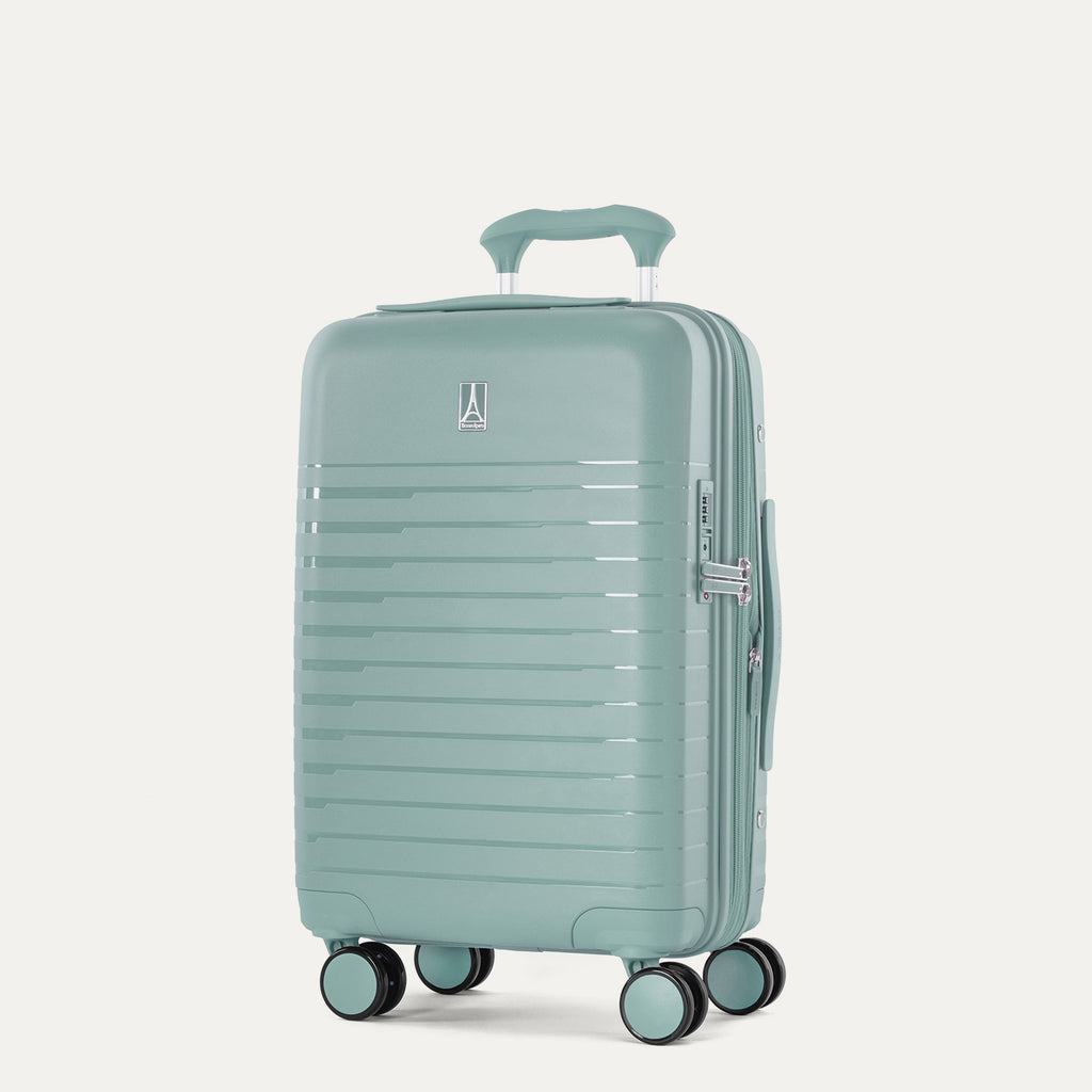 Front-facing view of the Optima Expandable Carry-on Spinner in Lunar Rock, showing the upright hardshell suitcase with horizontal ribbed detailing, an extended telescoping handle, top carry handle, and smooth-rolling multi-directional wheels against a solid off-white background.