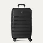 Black suitcase with a visible brand logo on a light gray background