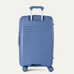 Blue suitcase with a textured surface on a light gray background