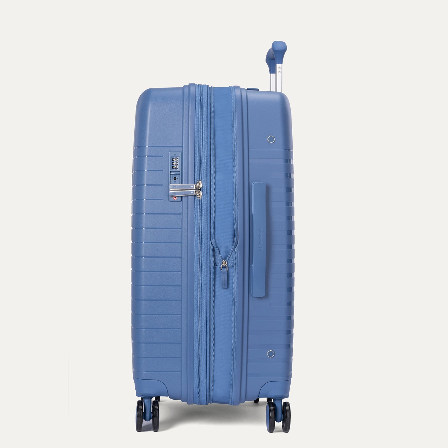 Blue suitcase on a light gray background