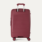 Maroon suitcase with a textured surface on a light gray background