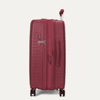 Red suitcase with wheels on a light gray background