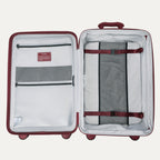 Open suitcase with interior organization panels on a white background