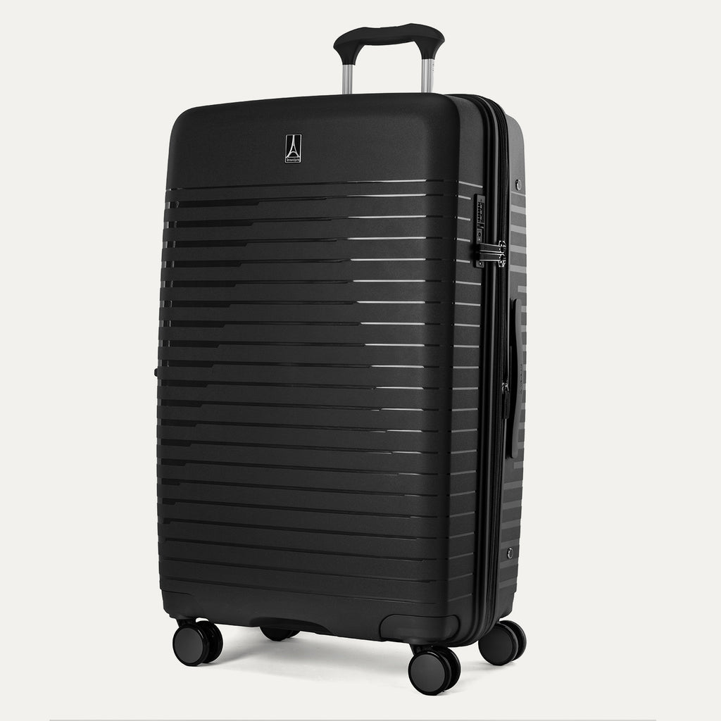 Black suitcase with a ribbed texture on a white background
