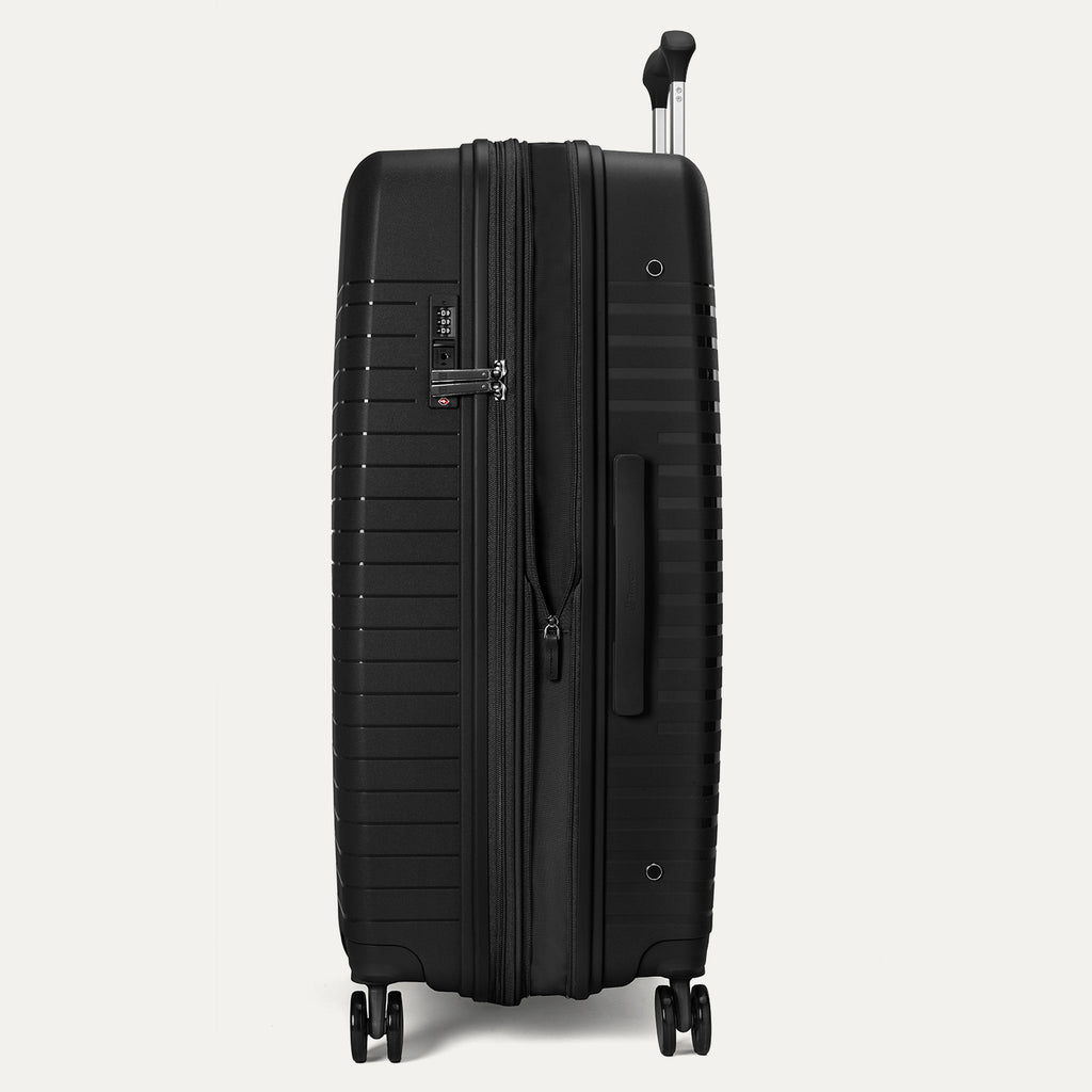 Black suitcase with wheels on a light gray background