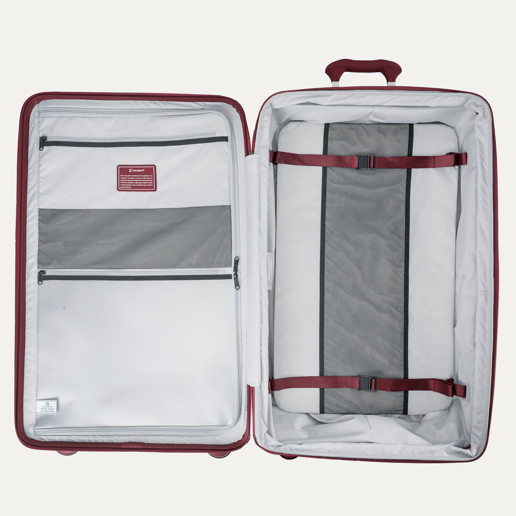 Open suitcase with interior organization panels and straps on a white background