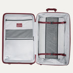 Open suitcase with interior organization panels and straps on a white background