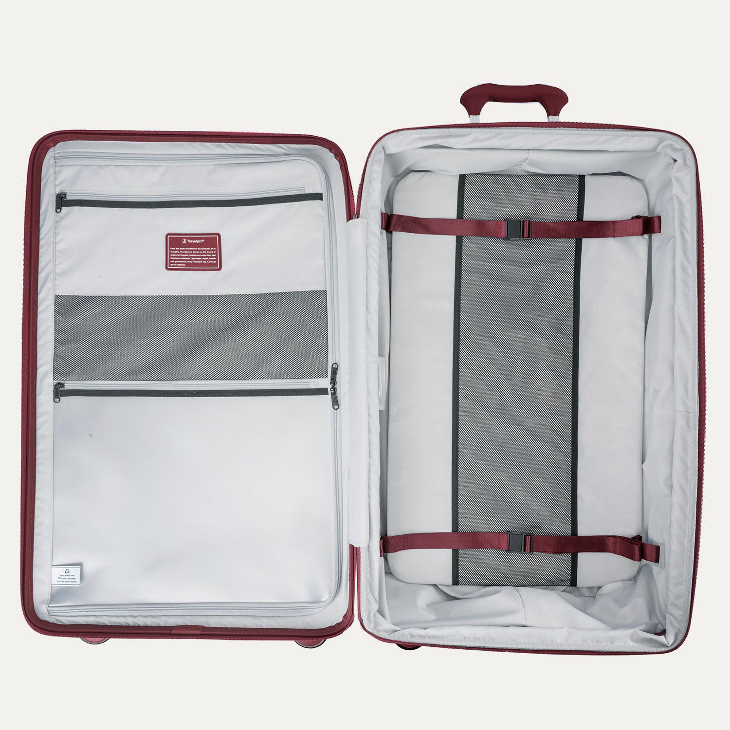 Open suitcase with interior organization panels and straps on a white background