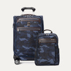 A set of Travelpro Platinum Elite luggage, featuring a carry-on spinner and a slim backpack, both in a camouflage pattern with premium leather and polished chrome zippers.