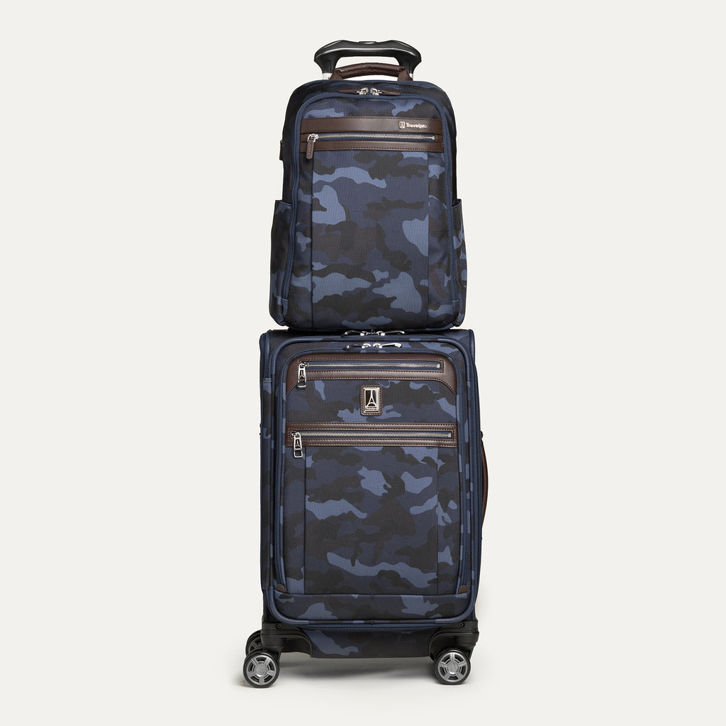 Front view of the Travelpro Platinum Elite Slim Backpack stacked on matching Carry-On Spinner in camouflage, featuring rear stacking strap.

