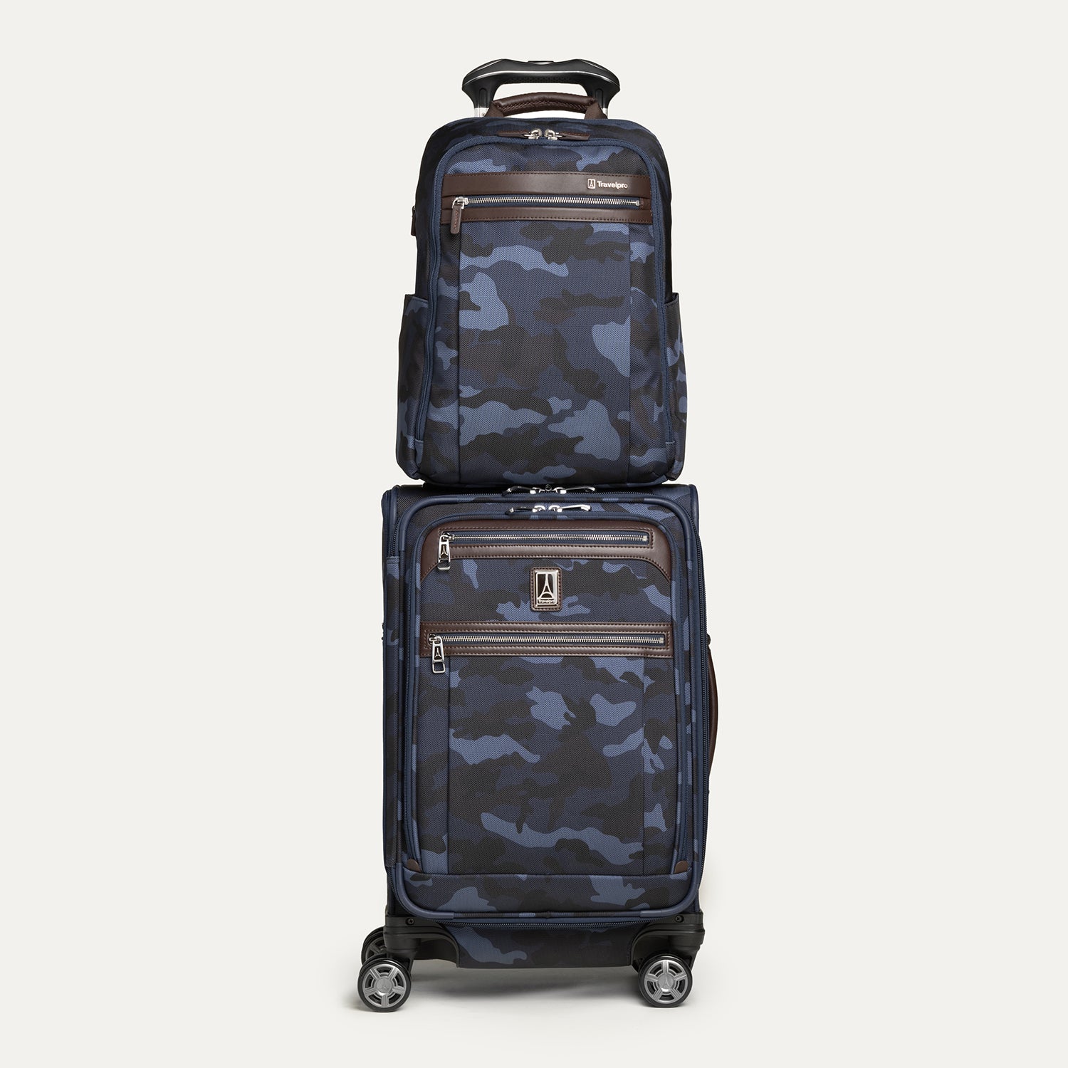 Front view of the Travelpro Platinum Elite Slim Backpack stacked on matching Carry-On Spinner in camouflage, featuring rear stacking strap.
