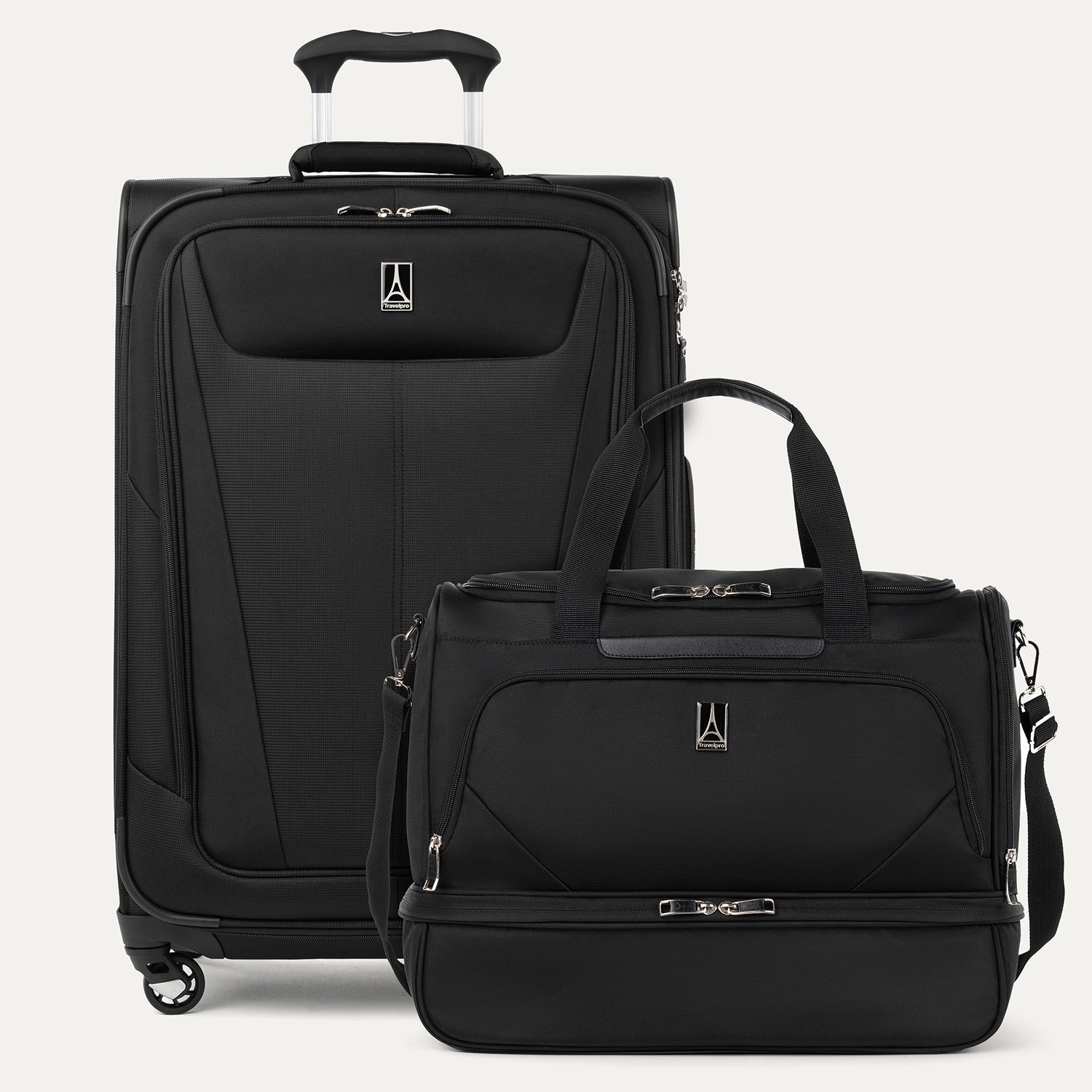 Black suitcase and weekender bag with visible brand logo on a white background