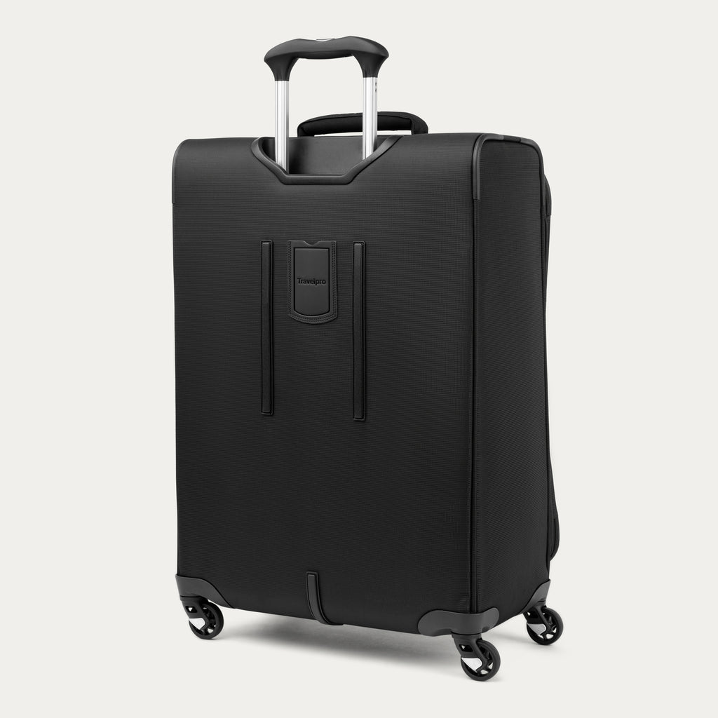 Black suitcase with wheels and handle on a white background