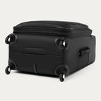 Black suitcase with black wheels on a white background