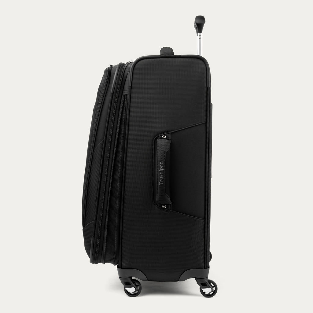 Side view of black suitcase with visible 'Travelpro' branding on a white background