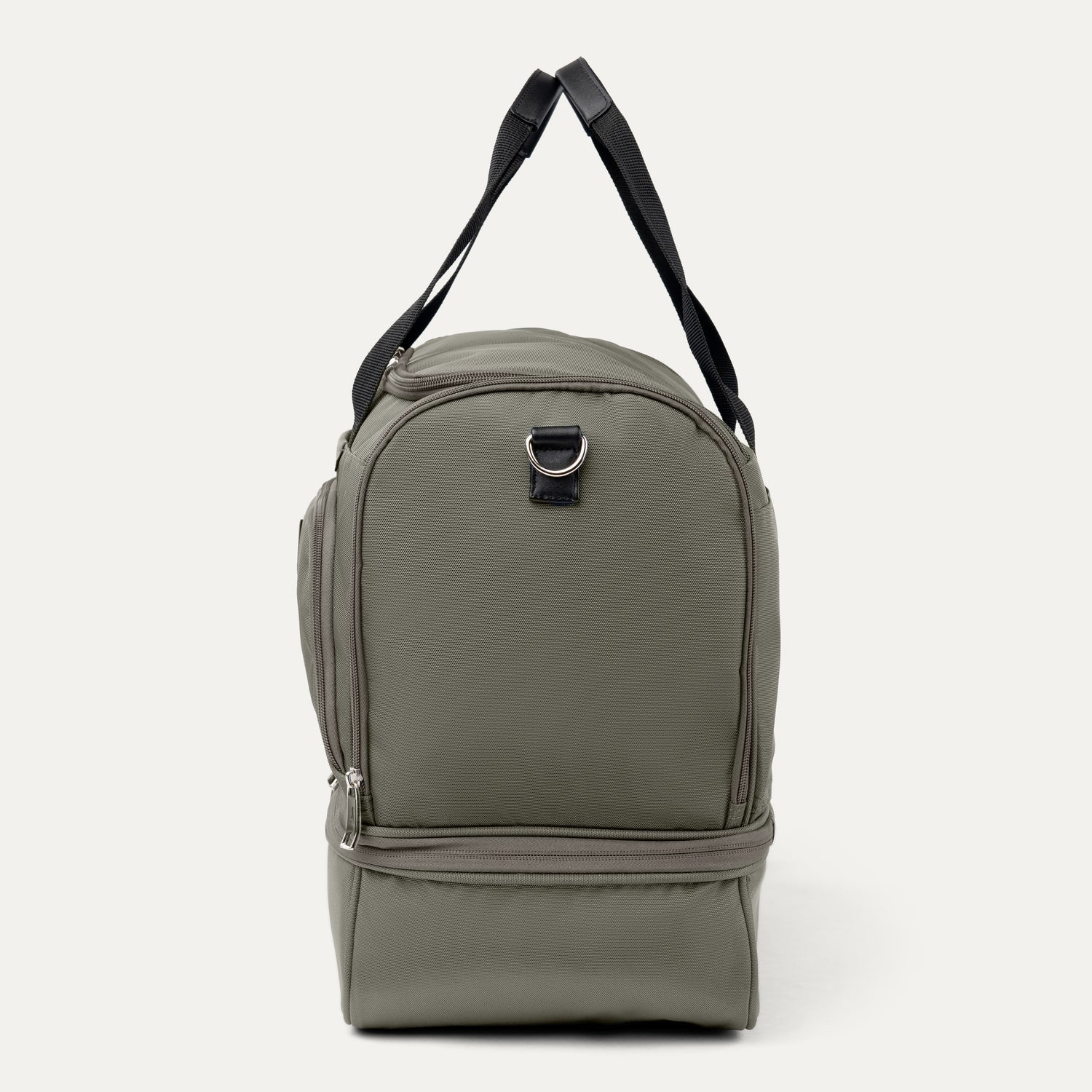 Sideview of green backpack with a black strap on a white background