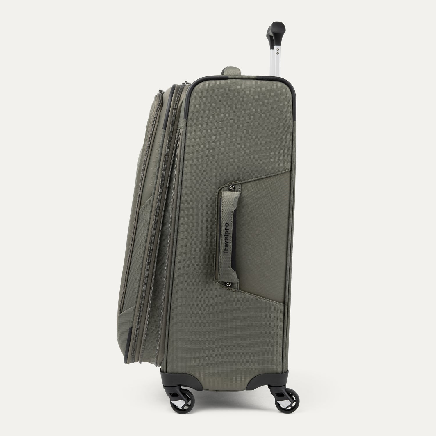 Side view of green suitcase with visible 'Travelpro' branding on a white background