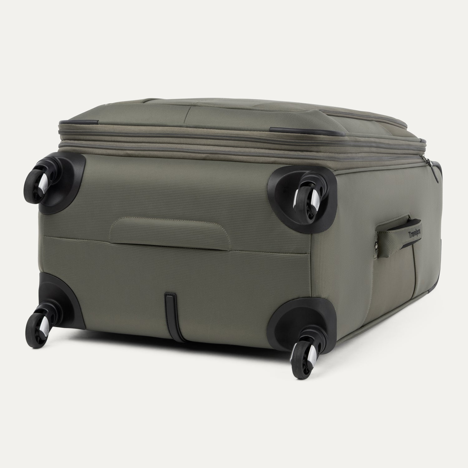 Green suitcase with black wheels on a white background