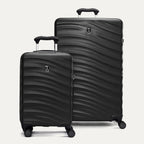 front view of the black travelpro maxlite air v2 set featuring the compact carry-on and large check-in hardside spinners with telescoping handles extended.